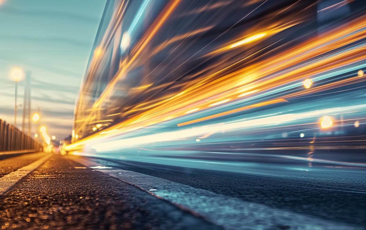 Blurred lights on a city highway at dusk, symbolizing website speed.
